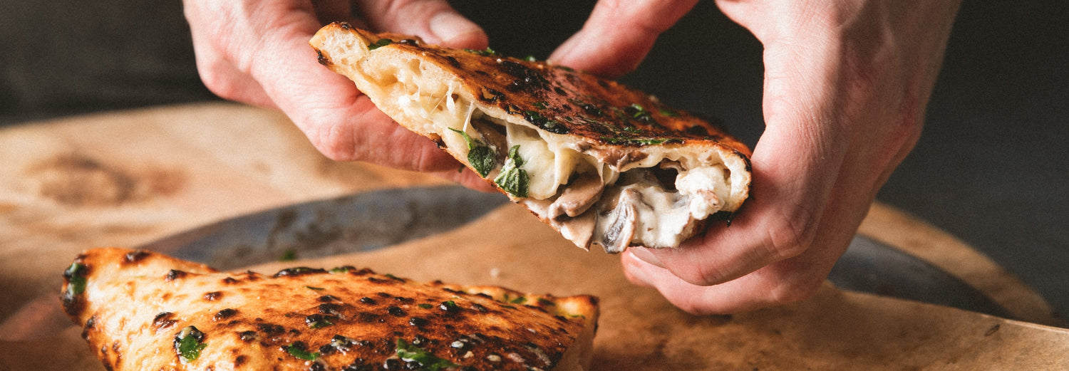 Mushroom and ricotta calzone with garlic butter recipe poster image
