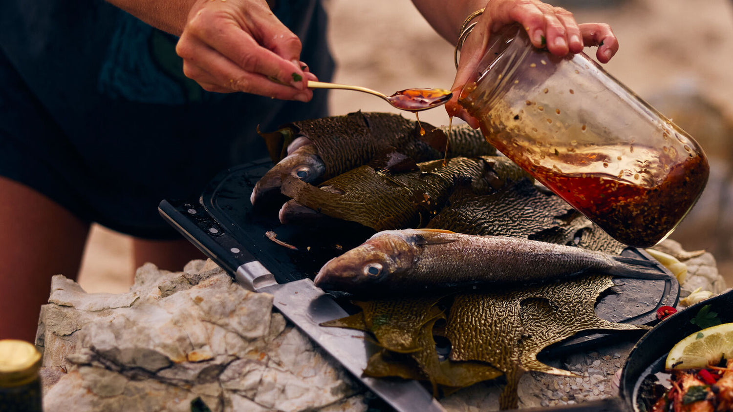 Wrapping Kelp around whiting and putting a honey glaze over it