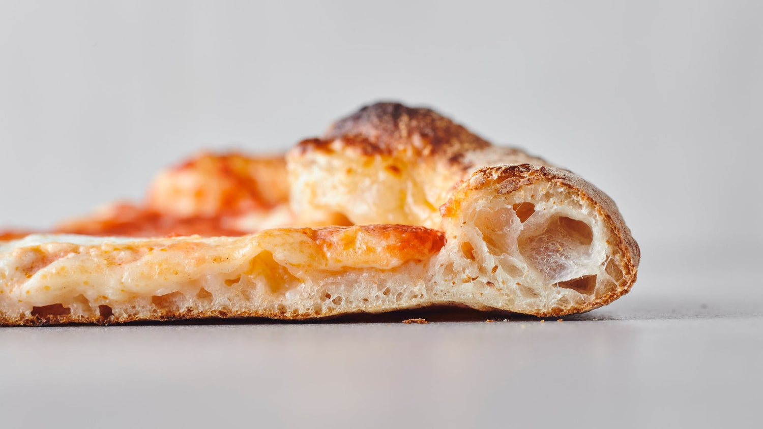 Side profile of a slice of pizza
